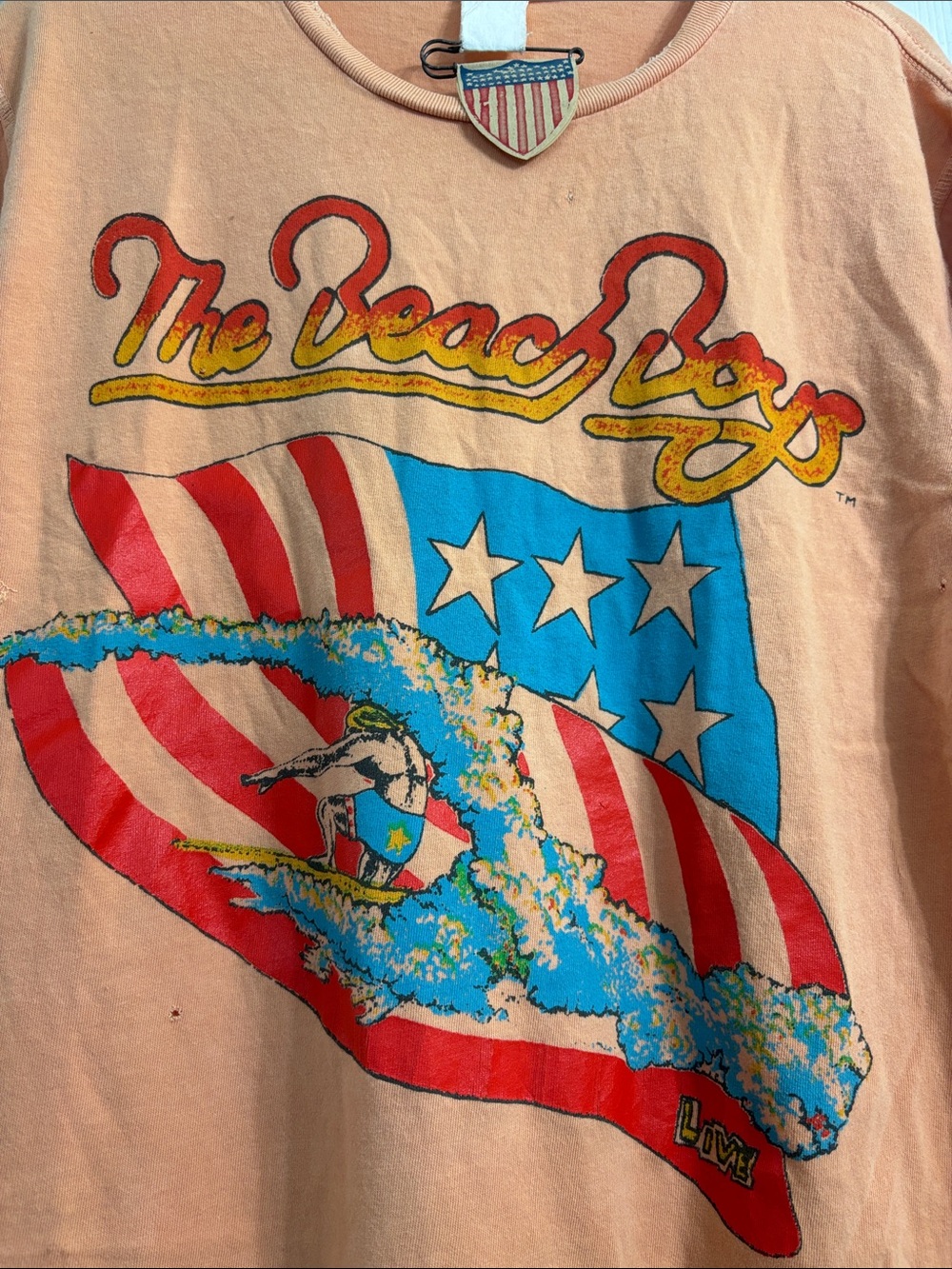 MadeWorn The Beach Boys Graphic Tee in Peach with Red, Blue and Yellow Print - Picture 3 of 6